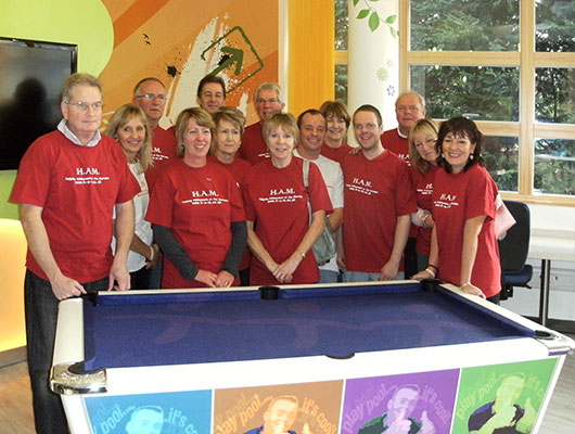 The Ham committee and members donating a pool table to the Marsden unit.